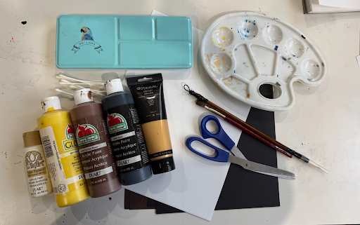 Art supplies for a mixed-media sunflower project.